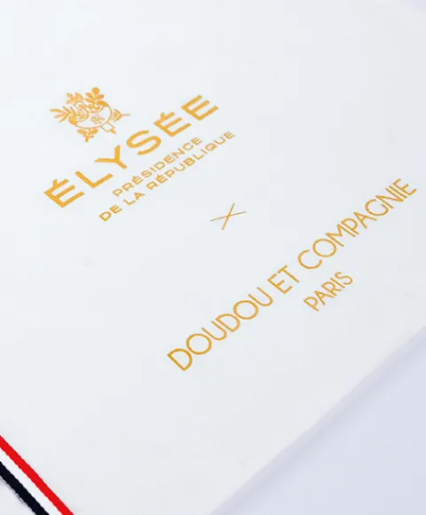 Doudou et Compagnie Doudou plat fabriqué en France - L'Ours Élysée - 22 cm> Doudou Plat